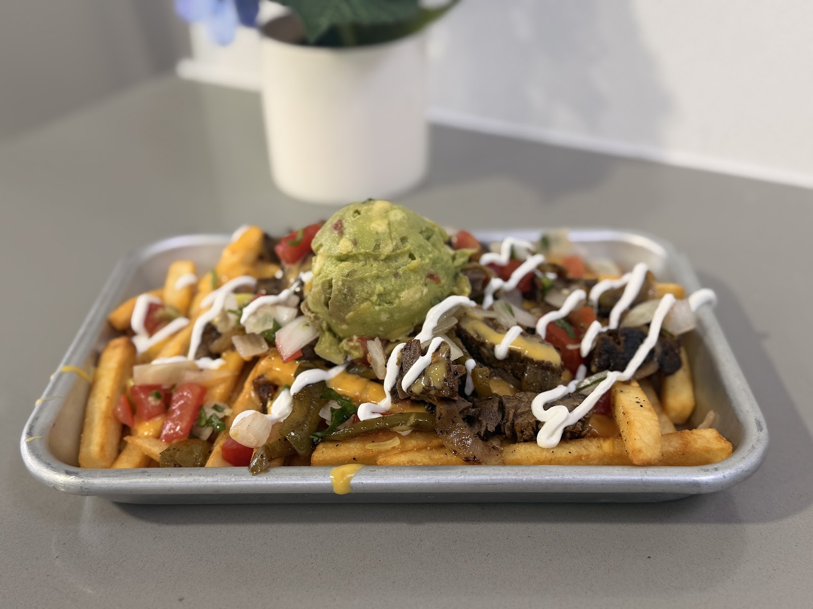 Loaded brisket queso fries at Tomel's